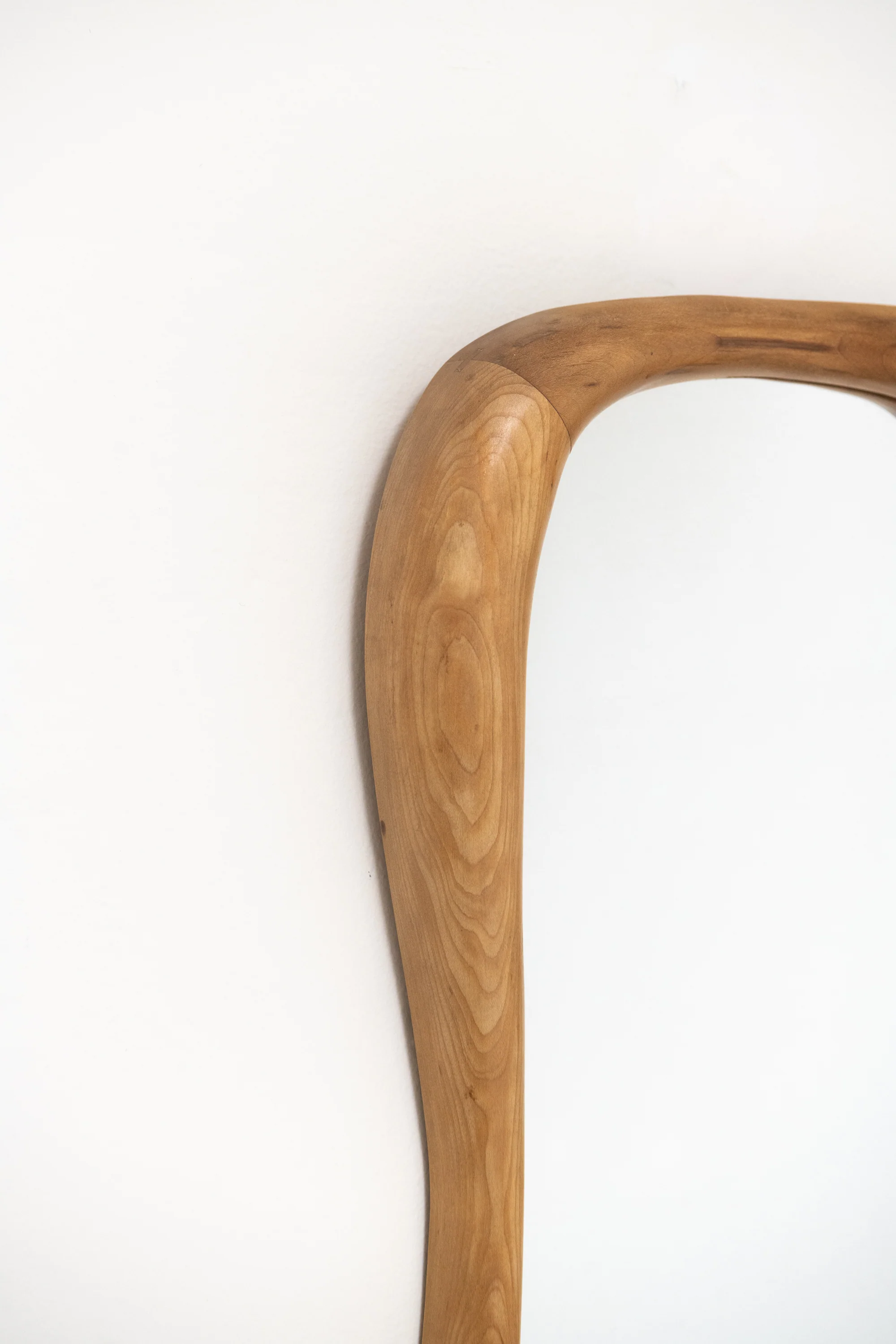 SWISS. SMOOTH CARVED ANTHROPOSOPHIC MIRROR. C. 1930