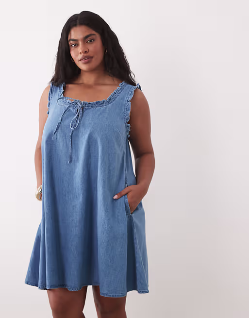 Curve denim ruffle detail mini dress with pockets in mid blue