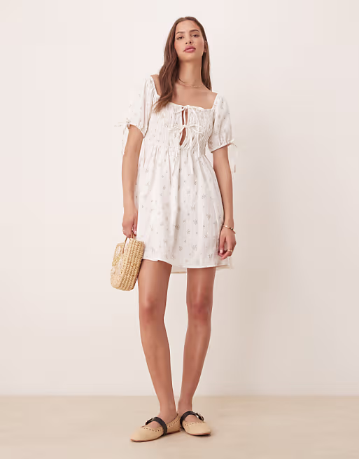 Esmee Exclusive tie front puff sleeve mini beach dress in white ditsy floral