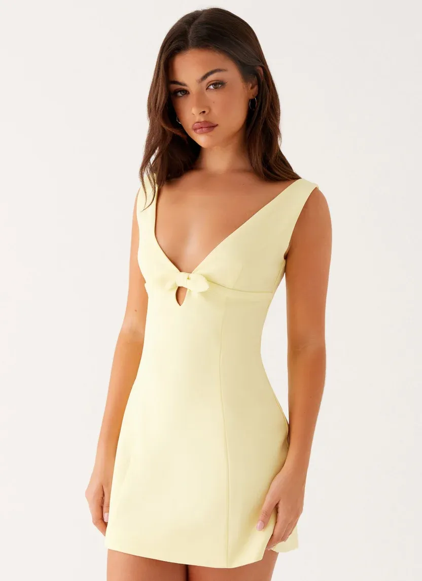 Elegant Yellow Deep V-Neck Mini Dress with Bow Accent
