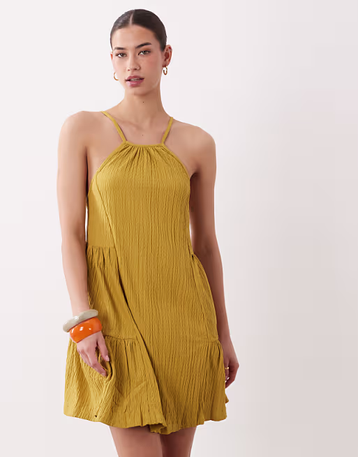 textured halter trapeze mini dress in ocre
