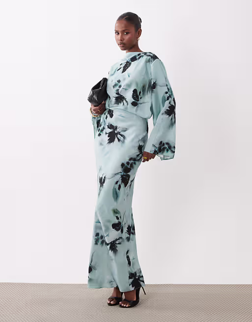 long sleeve tucked waist bias maxi dress in blue blurred floral print