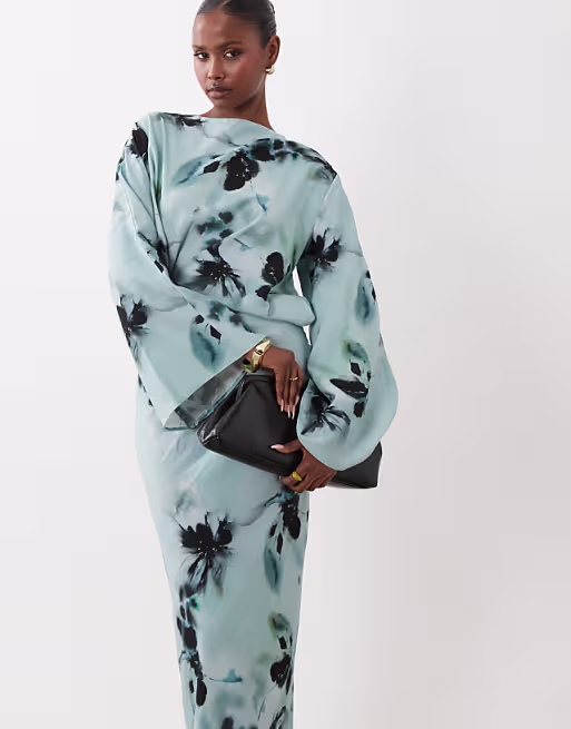 long sleeve tucked waist bias maxi dress in blue blurred floral print