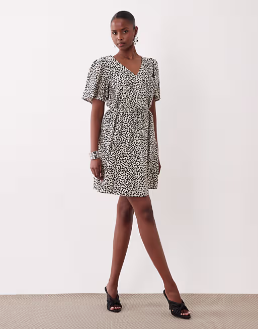 VILA tie waist polka dot mini dress in cream and black