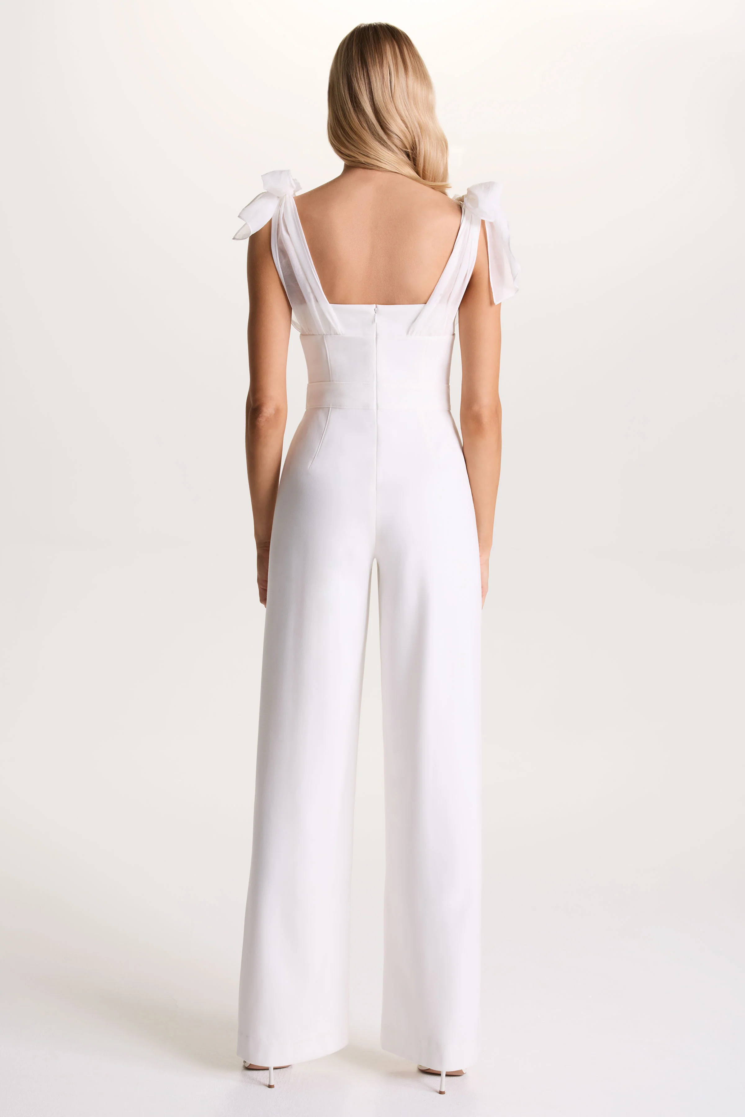 Claudelle | White Flared-Leg Jumpsuit With Organza Bow Straps