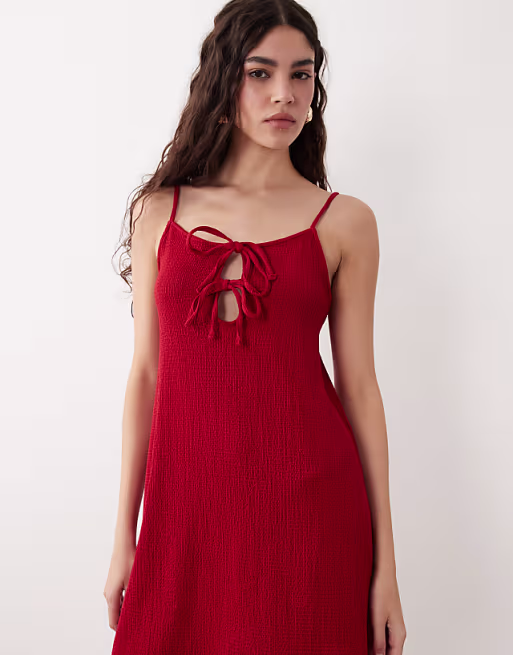 textured strappy mini dress with tie detail front in red