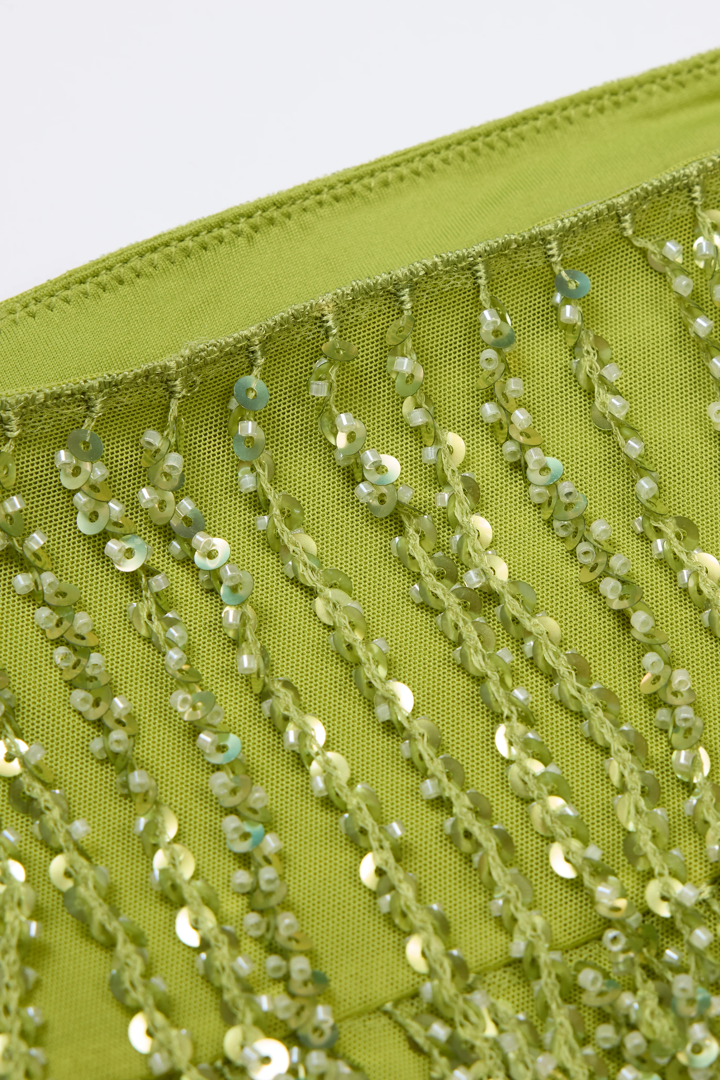 Fringed Low-Rise Mini Skirt in Olive