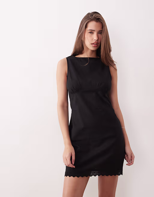 slash neck mini sundress with sculpted bust and eyelet hem in black