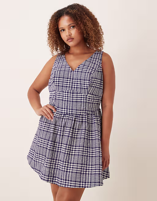 Curve waisted v-neck mini sundress with seaming details in navy gingham
