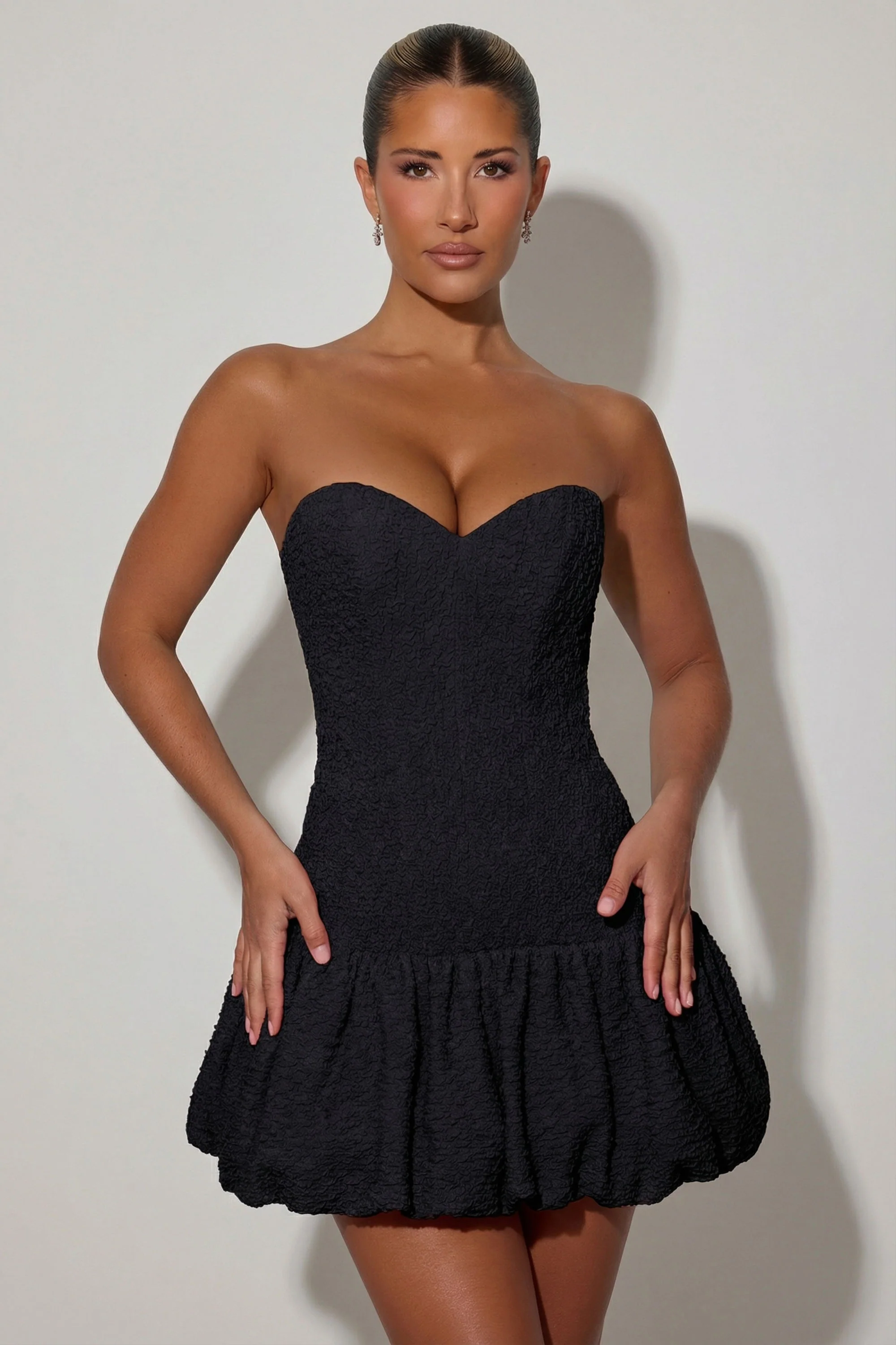 Cut-Out Bubble Hem Corset Mini Dress in Black