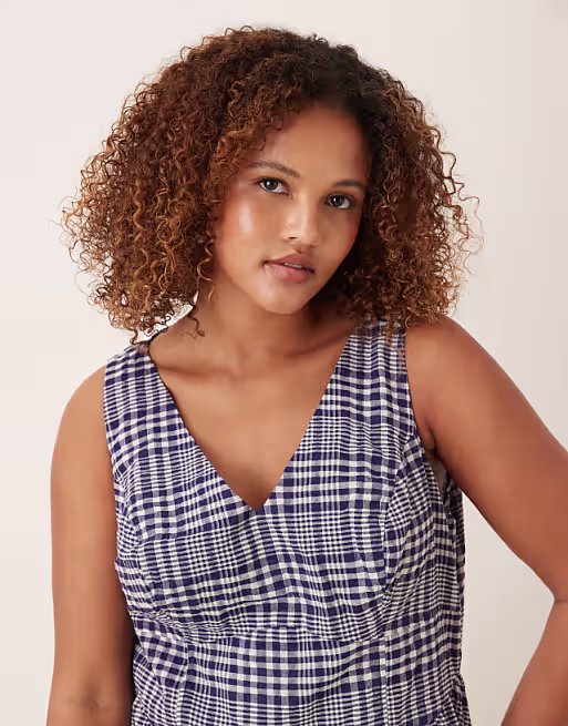 Curve waisted v-neck mini sundress with seaming details in navy gingham