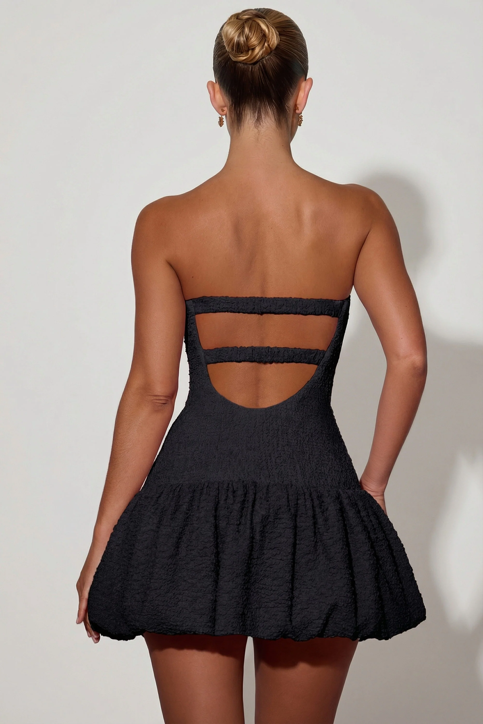 Cut-Out Bubble Hem Corset Mini Dress in Black