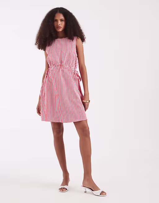 Vero Moda sleeveless bow tie side seersucker mini dress in pink and red gingham print