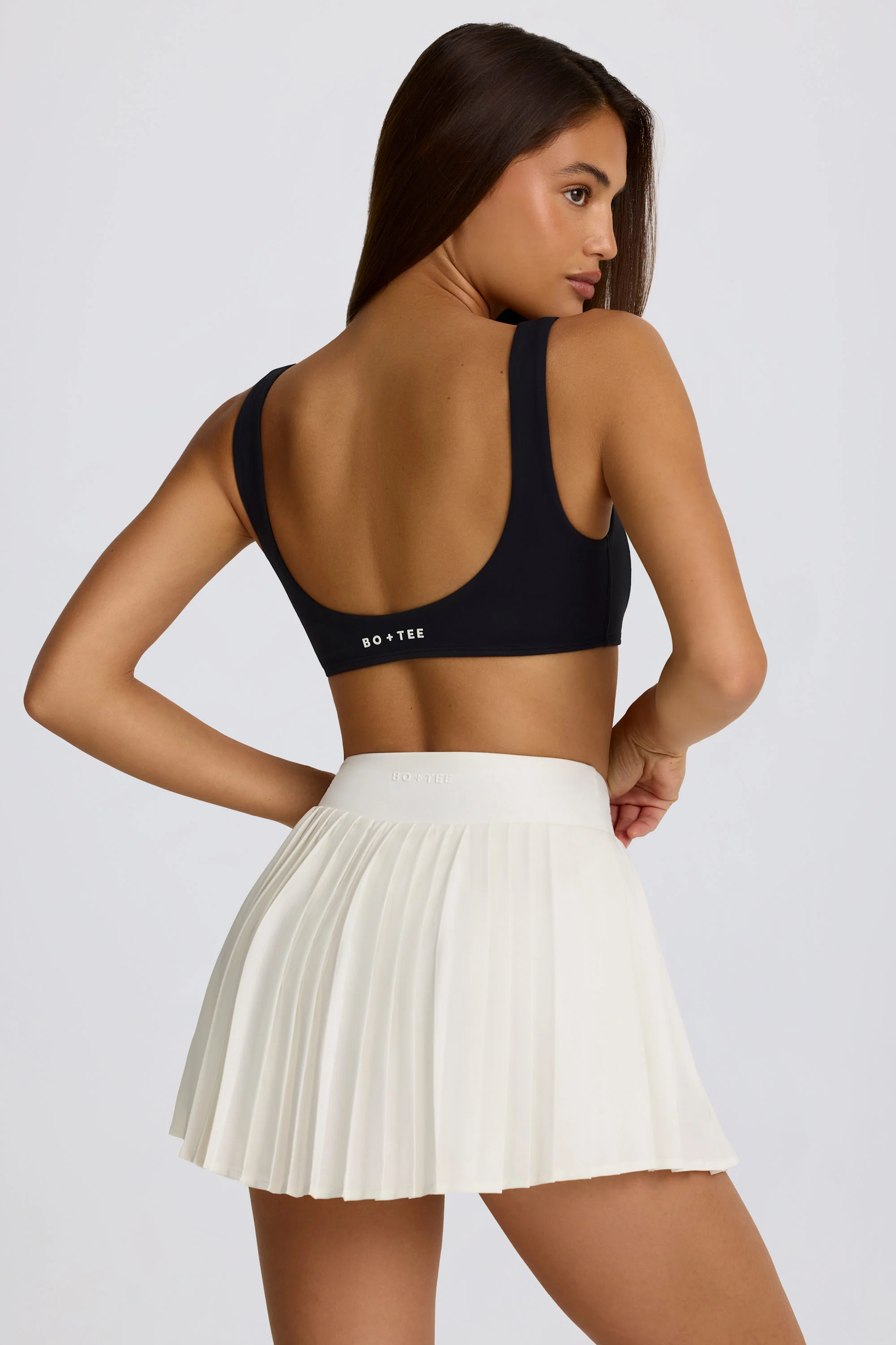 Soft Active Crossover Pleated Mini Skort in Ivory