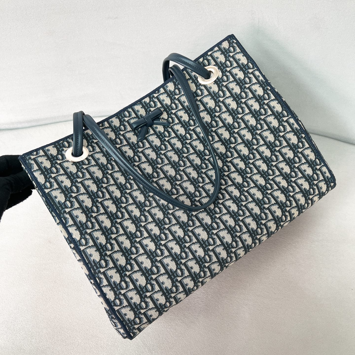 Dior Oblique Bow Medium Tote Bag Angle View | Nigo Office