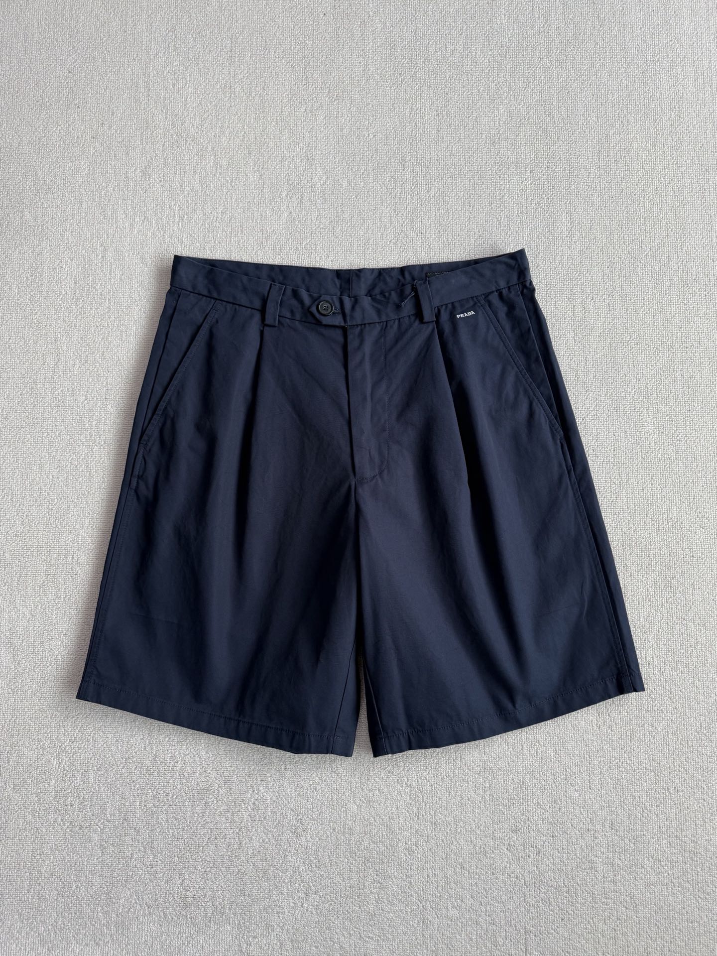 Prada Small Logo Embroidered Pleated Shorts #383837