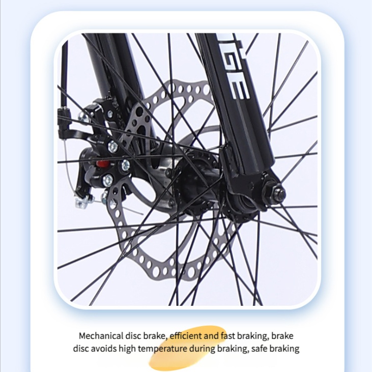 Close-up of mountain bike front wheel with mechanical disc brake system and suspension fork for reliable stopping power.