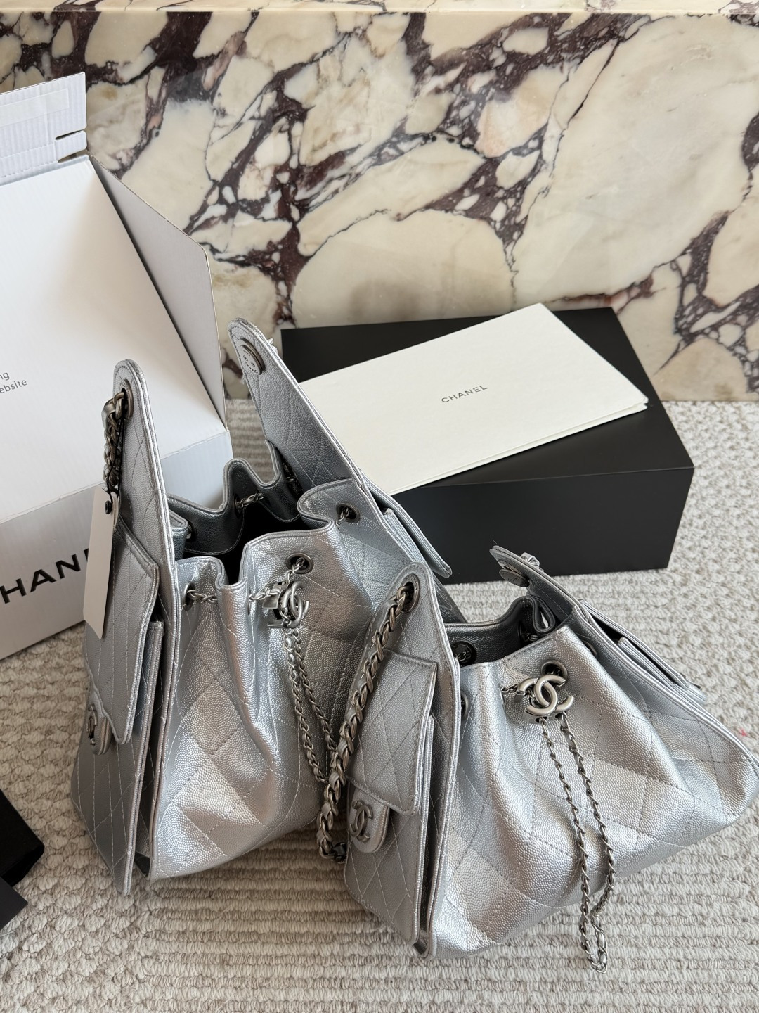 Chanel Silver Quilted Hobo Bag with Chain Strap and CC Logo Charm (Replica)