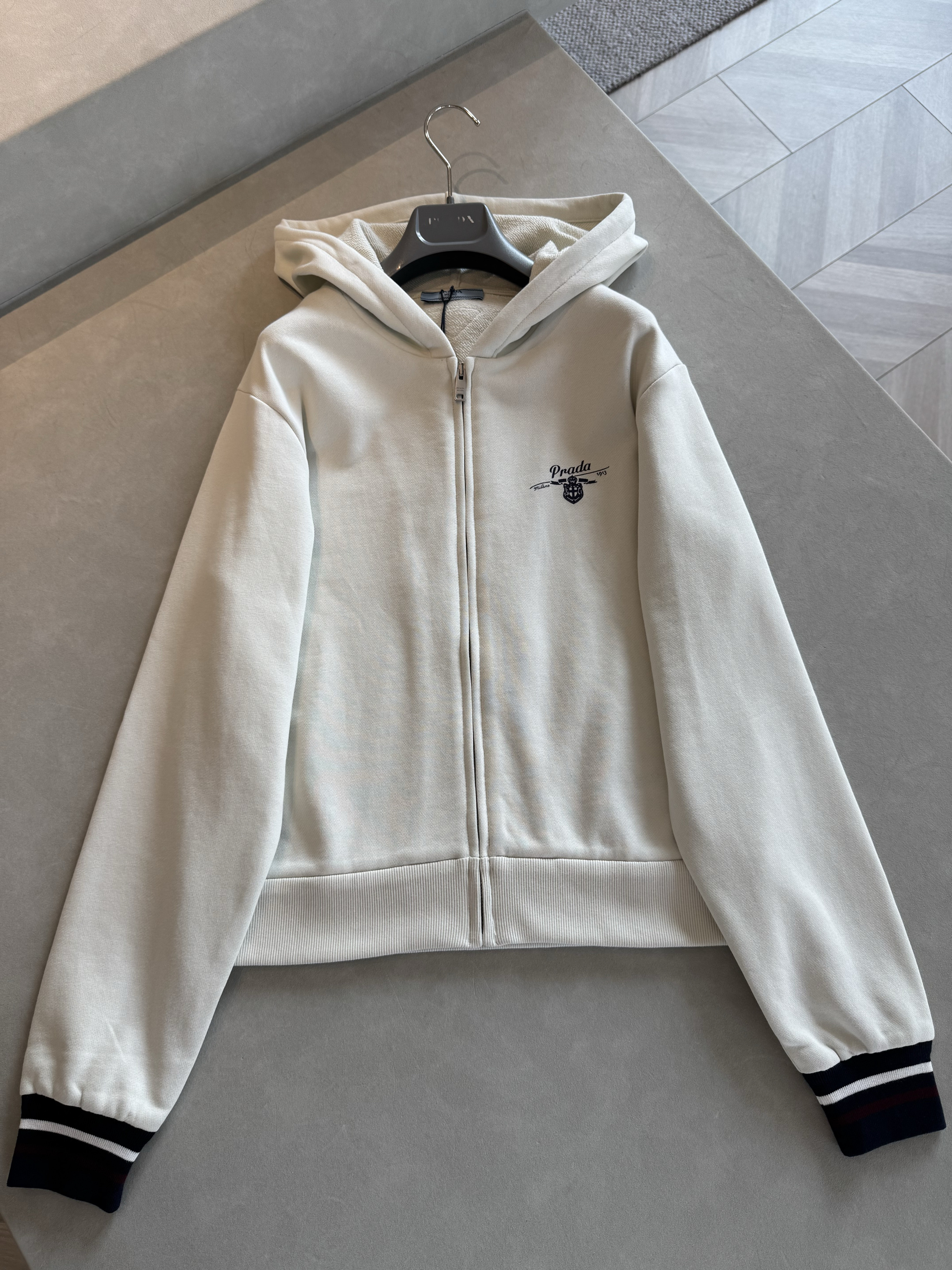 Prada white Clothing Prada White Hooded Zipper Sweatshirt View 2 | Nigo Office