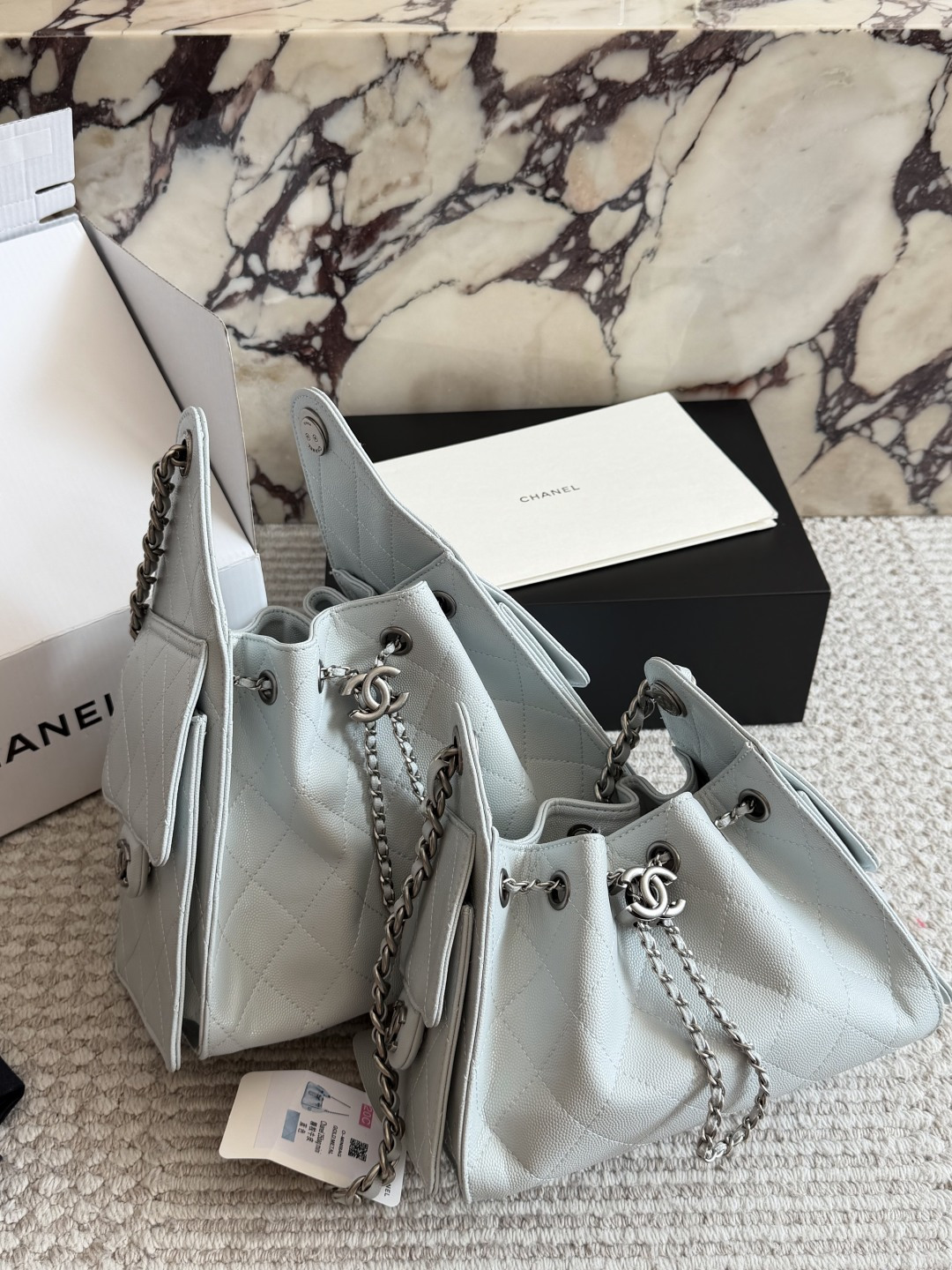 Chanel Light Blue Quilted Hobo Bag with Chain Strap and CC Logo Charm (Replica)