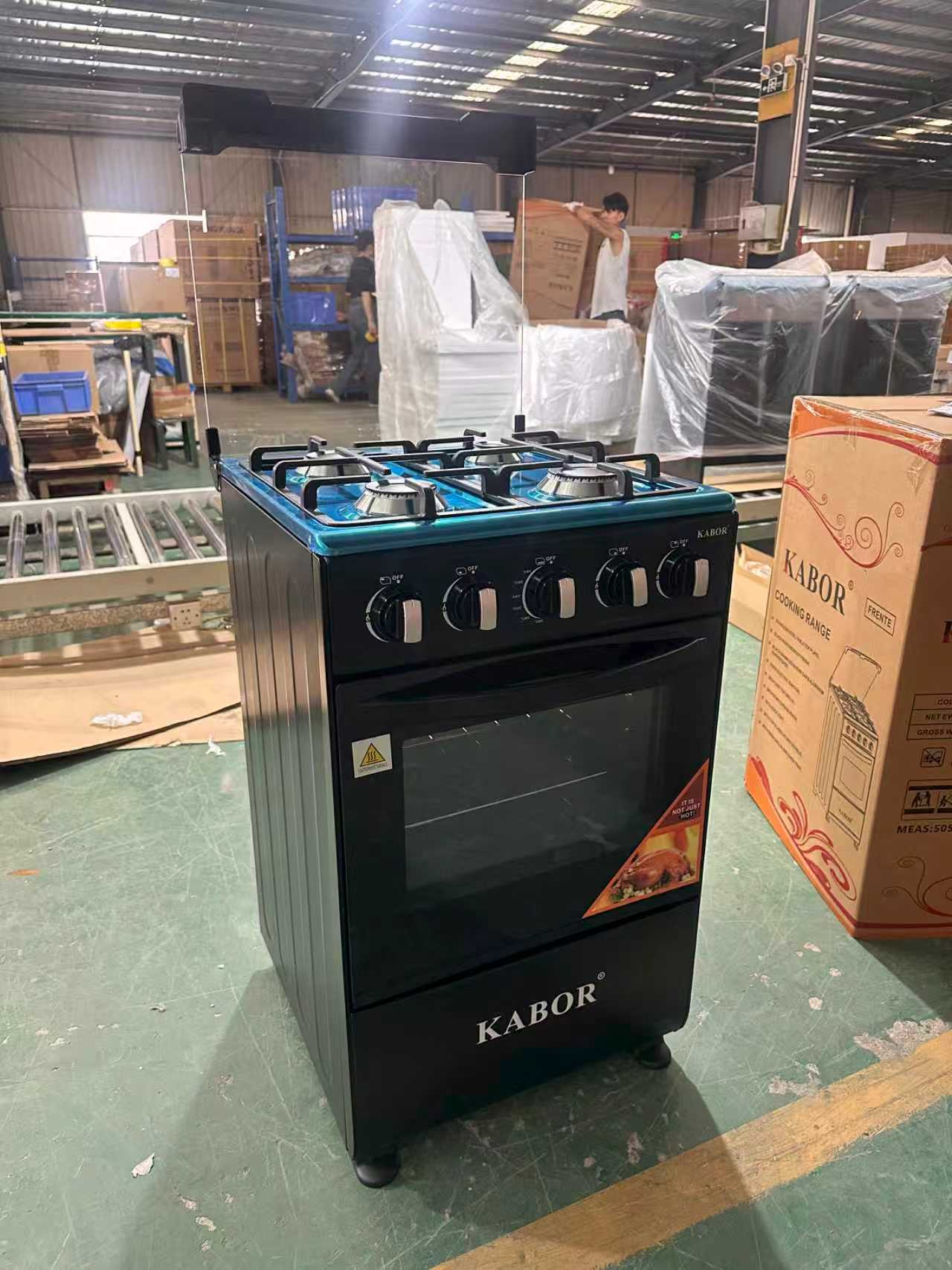 Household freestanding electric cooker with four burners and an oven/grill.,-0.26CBM