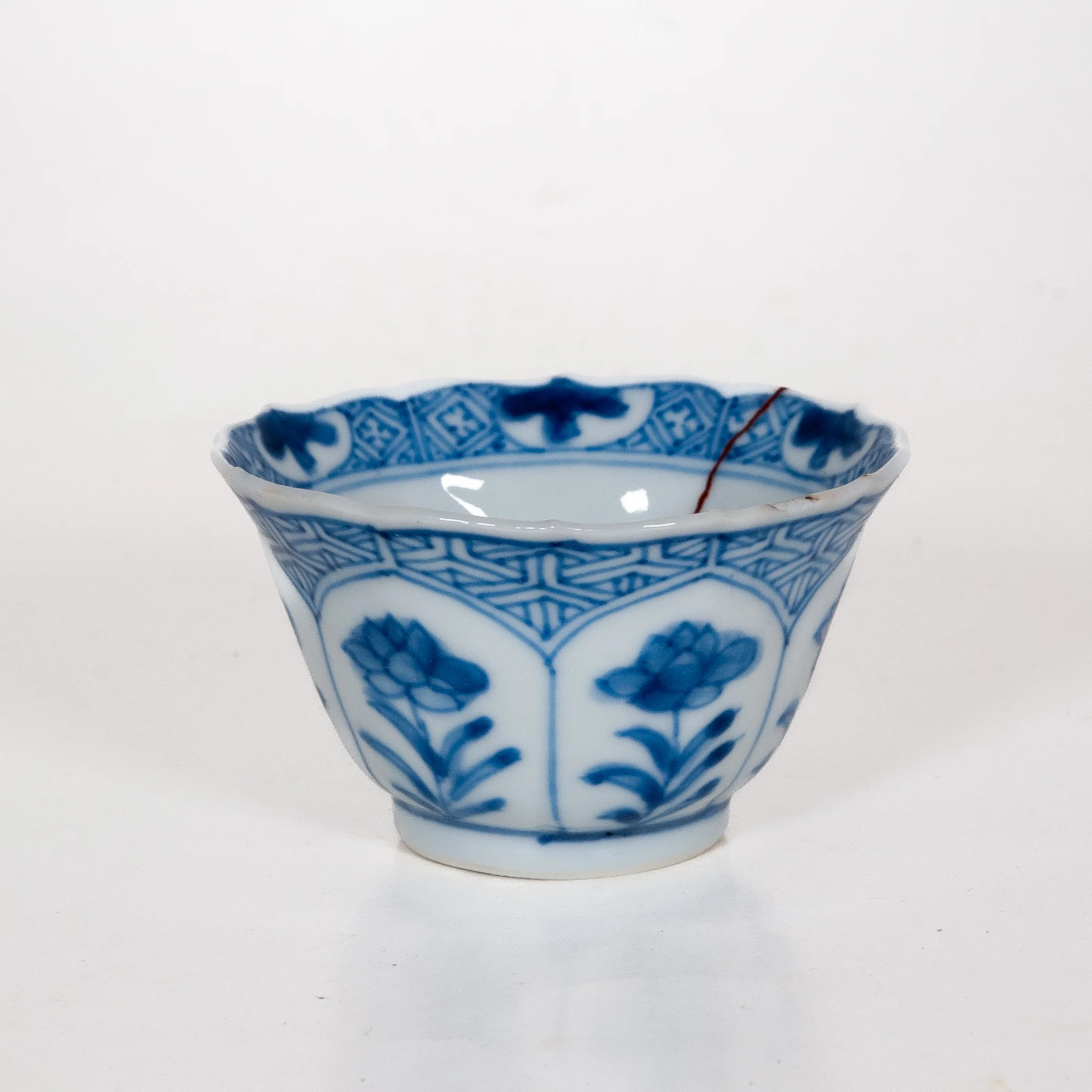 Antique Qing Dynasty Repaired Porcelain Blue And White Floral Motifs Tea Cup, Kangxi (1661-1722)
