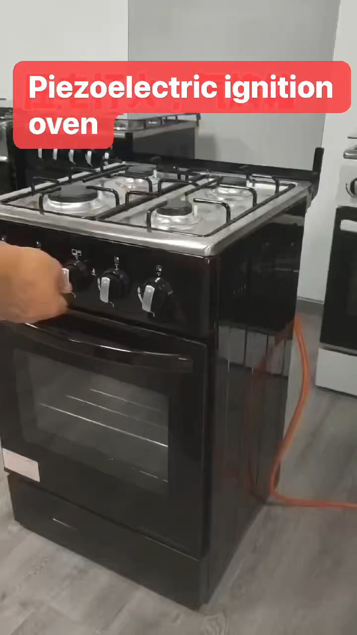 Household freestanding electric cooker with four burners and an oven/grill.,-0.26CBM