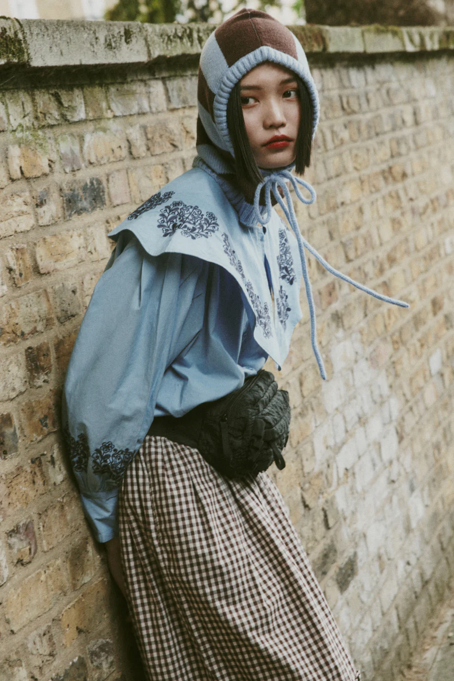 frill cross body bag in black floral stitch