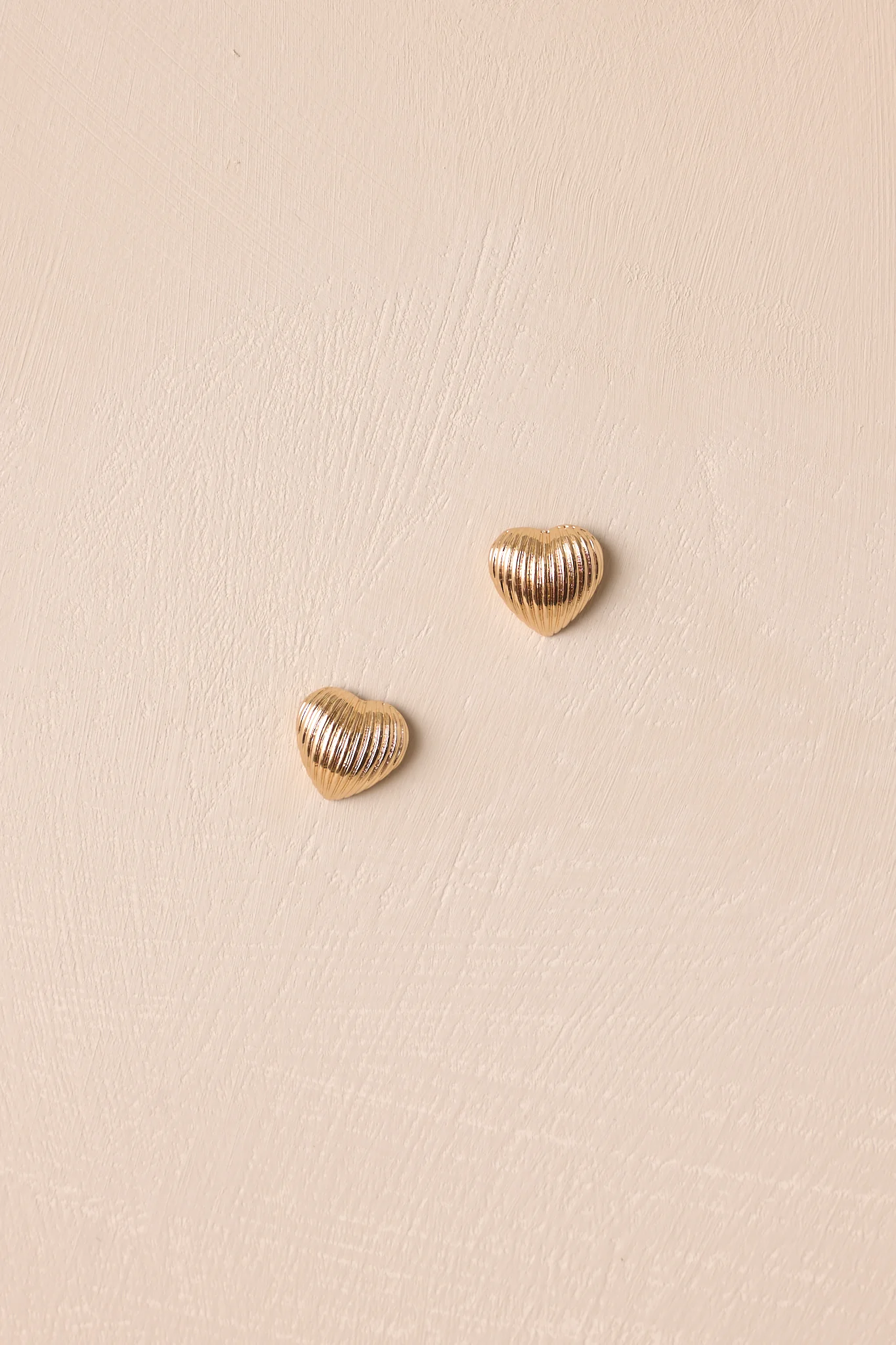 The Whispering Chasm Gold Textured Heart Earrings