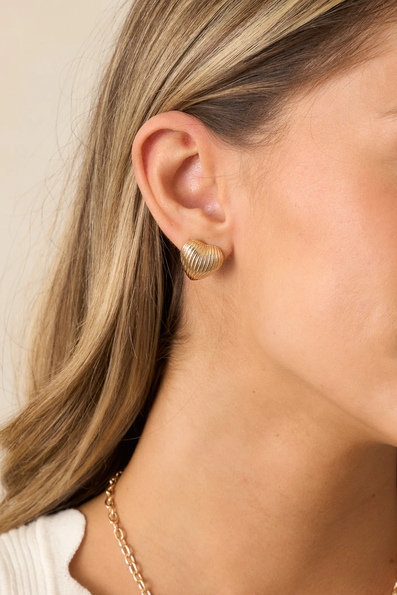The Whispering Chasm Gold Textured Heart Earrings