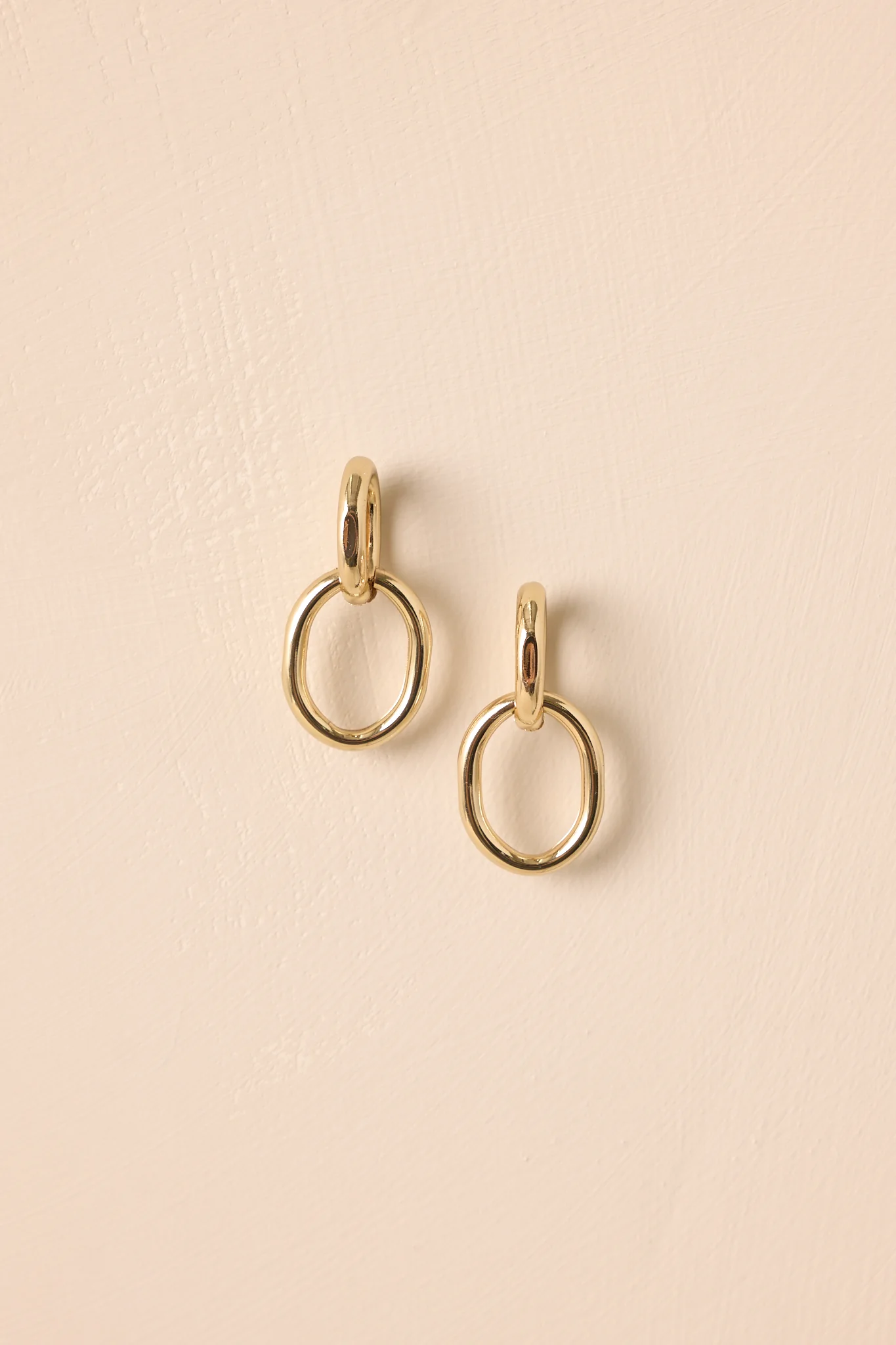 Dressed For The Drama Gold Interlocking Drop Earrings
