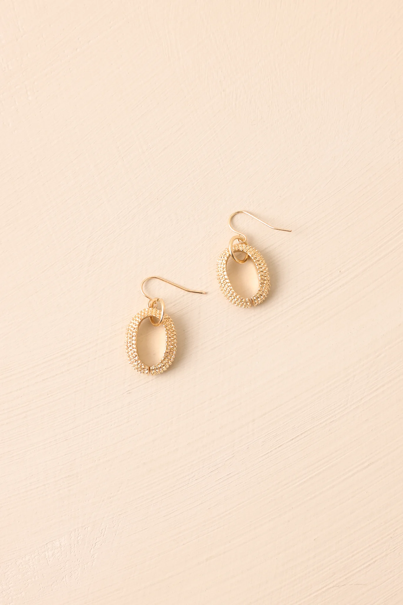 Long Story Short Gold Textured Oval Drop Earrings