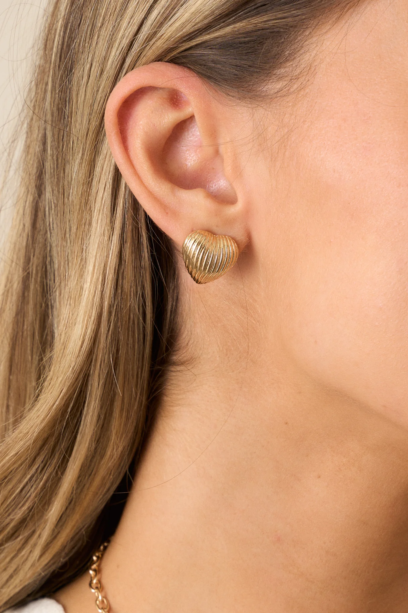 The Whispering Chasm Gold Textured Heart Earrings