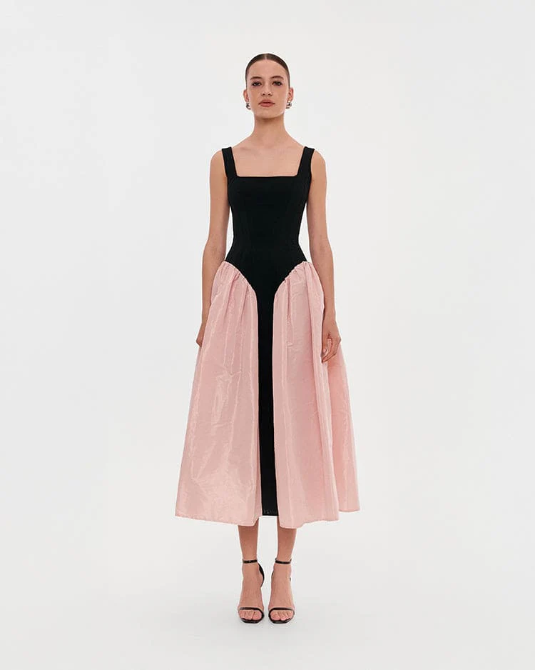 Black corset dress on straps with a glossy pink midi skirt