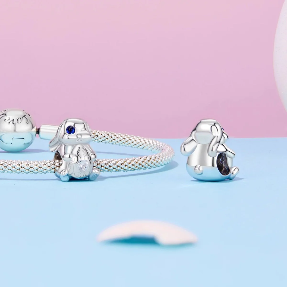 Winking Bunny with Heart-Shaped Egg Charm