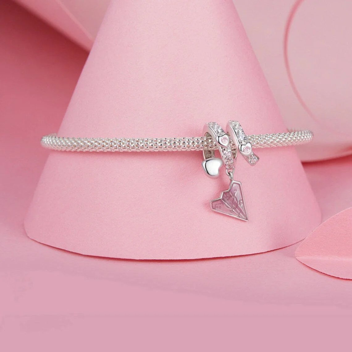 Crystal-Studded Heart Spiral with Pink Paper Plane Charm