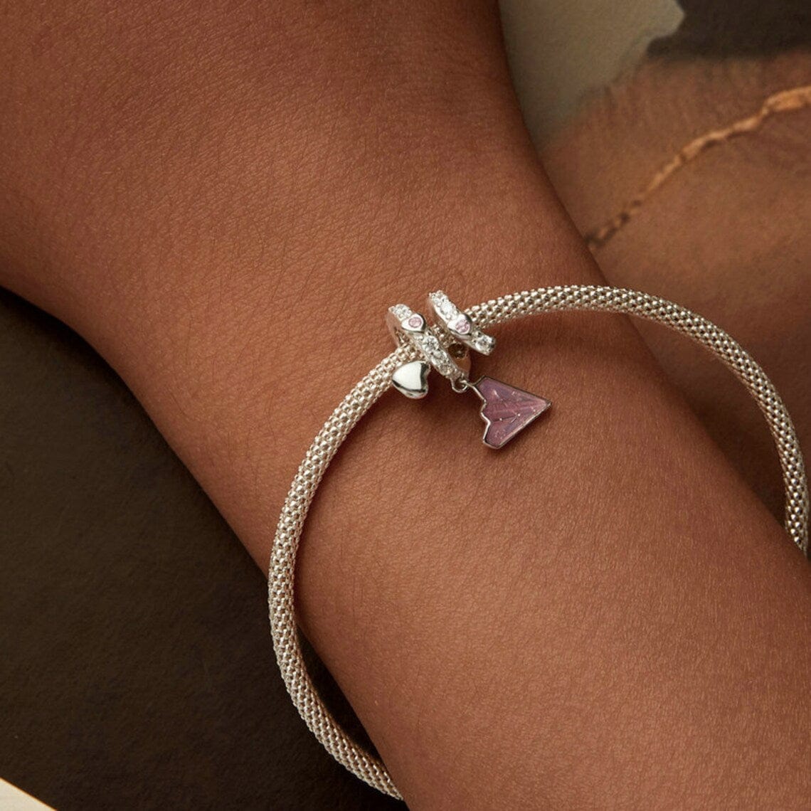 Crystal-Studded Heart Spiral with Pink Paper Plane Charm