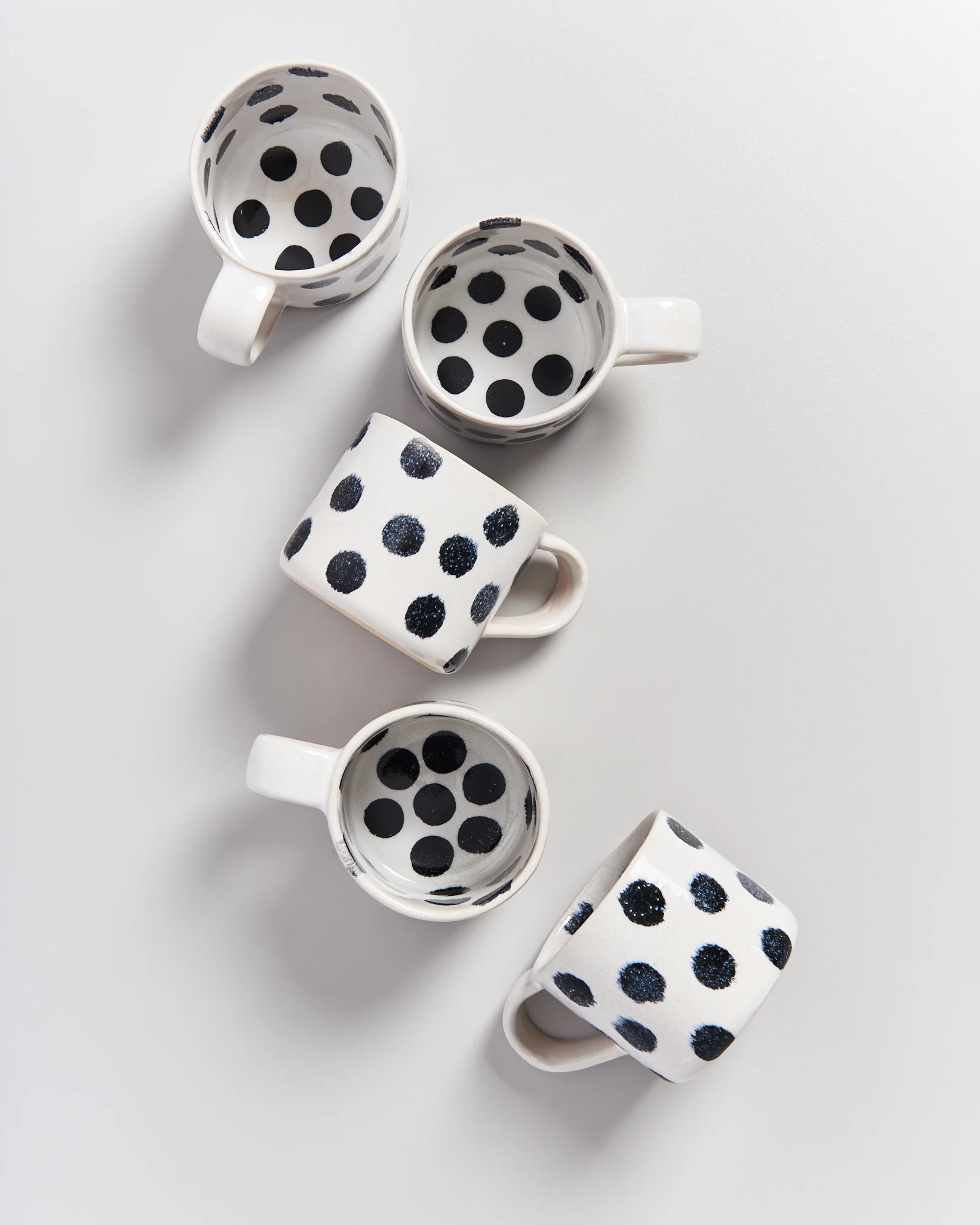 Nódoa Tasse schwarze Punkte