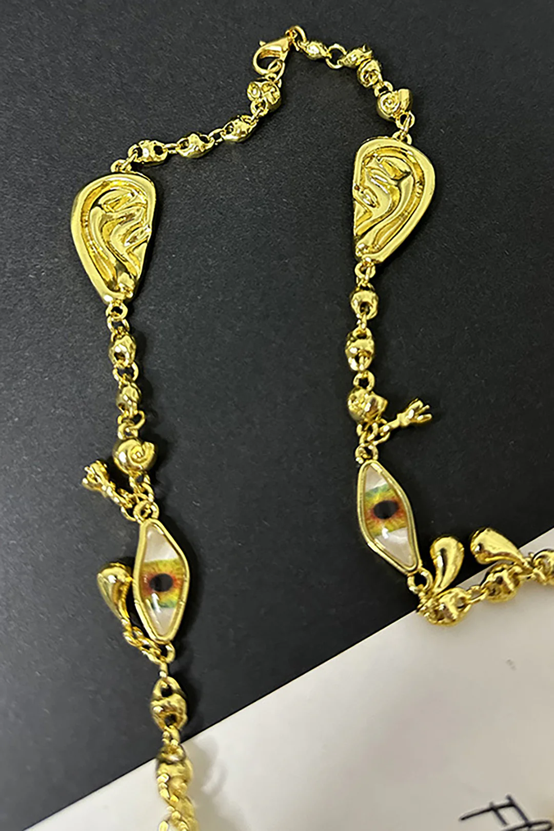 Ear, Eye, and Nose Design Necklace