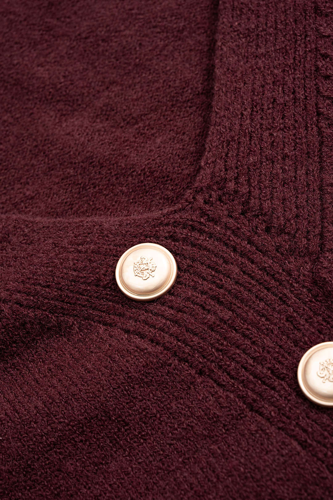 Asymmetrical Metallic Button Long Sleeve Knit Top