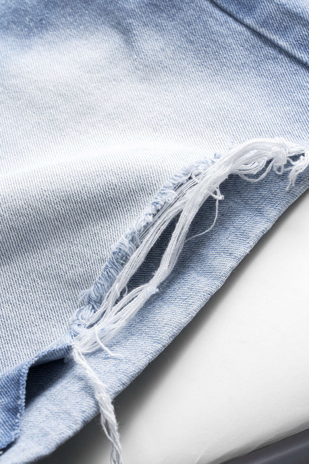 Asymmetrical Button Pocket Ripped Denim Shorts