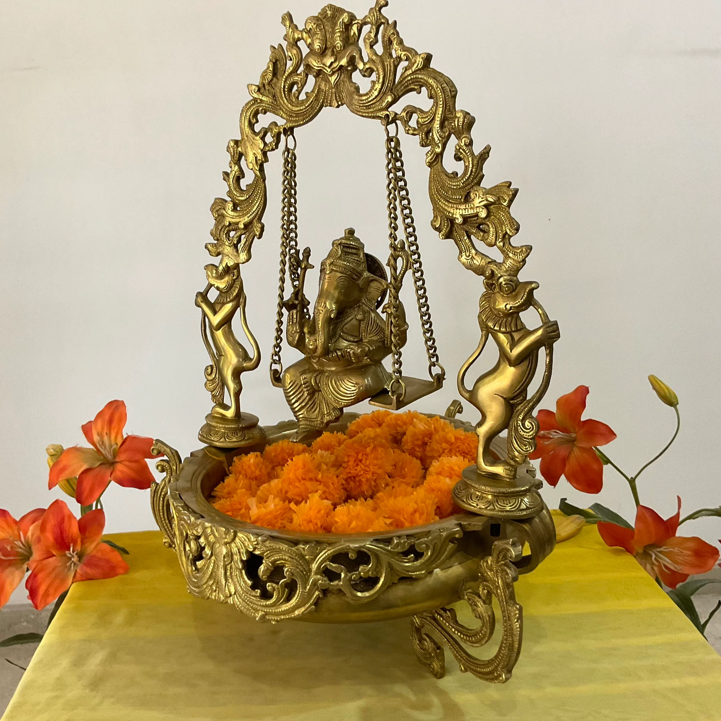 Ganesha Swing Decorative Brass Urli - Festive Indian Decor