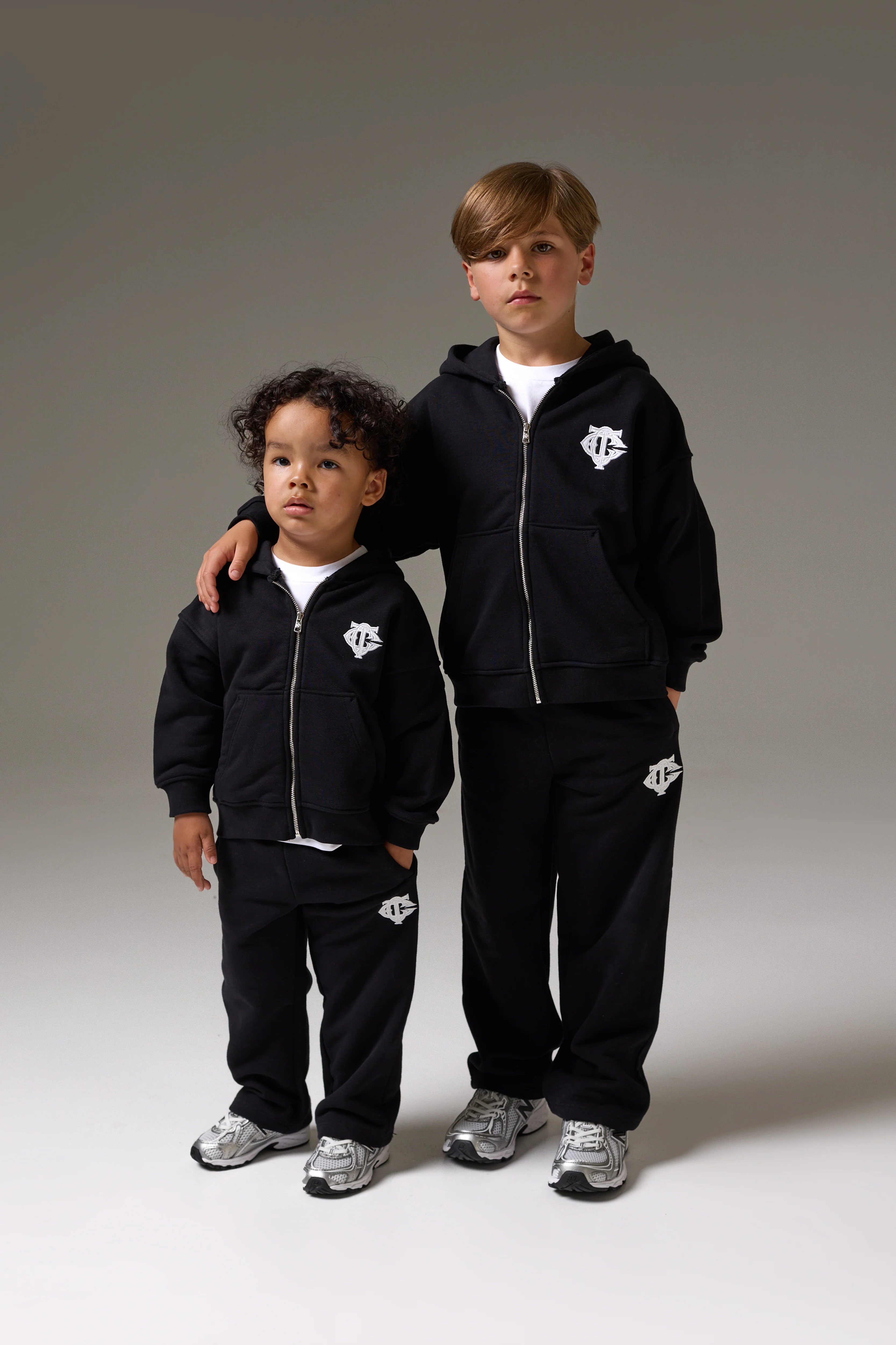 JUNIOR ZIP THROUGH MONOGRAM EMBLEM APPLIQUE HOODIE - BLACK