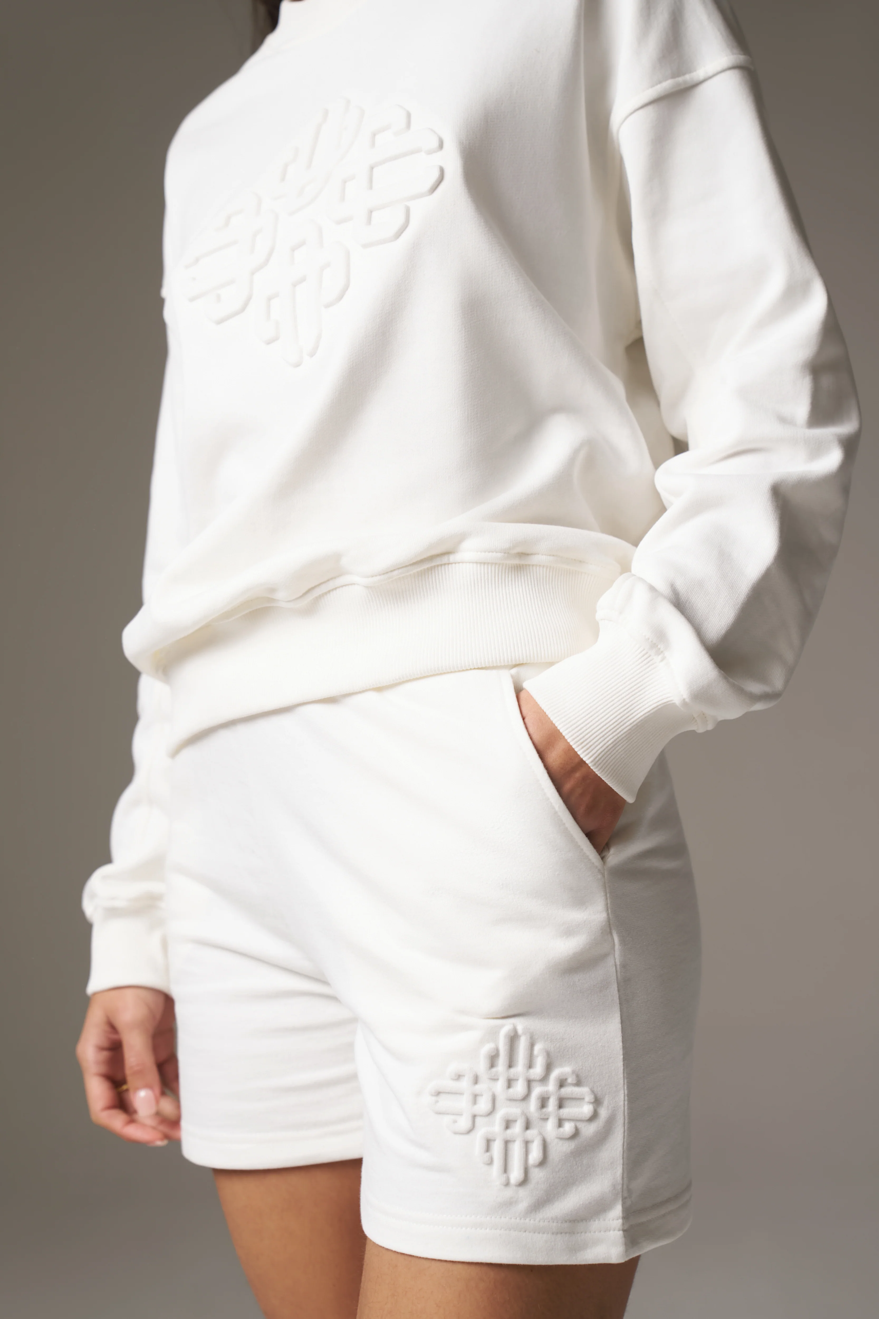 EMBLEM EMBOSSED SHORTS - OFF WHITE