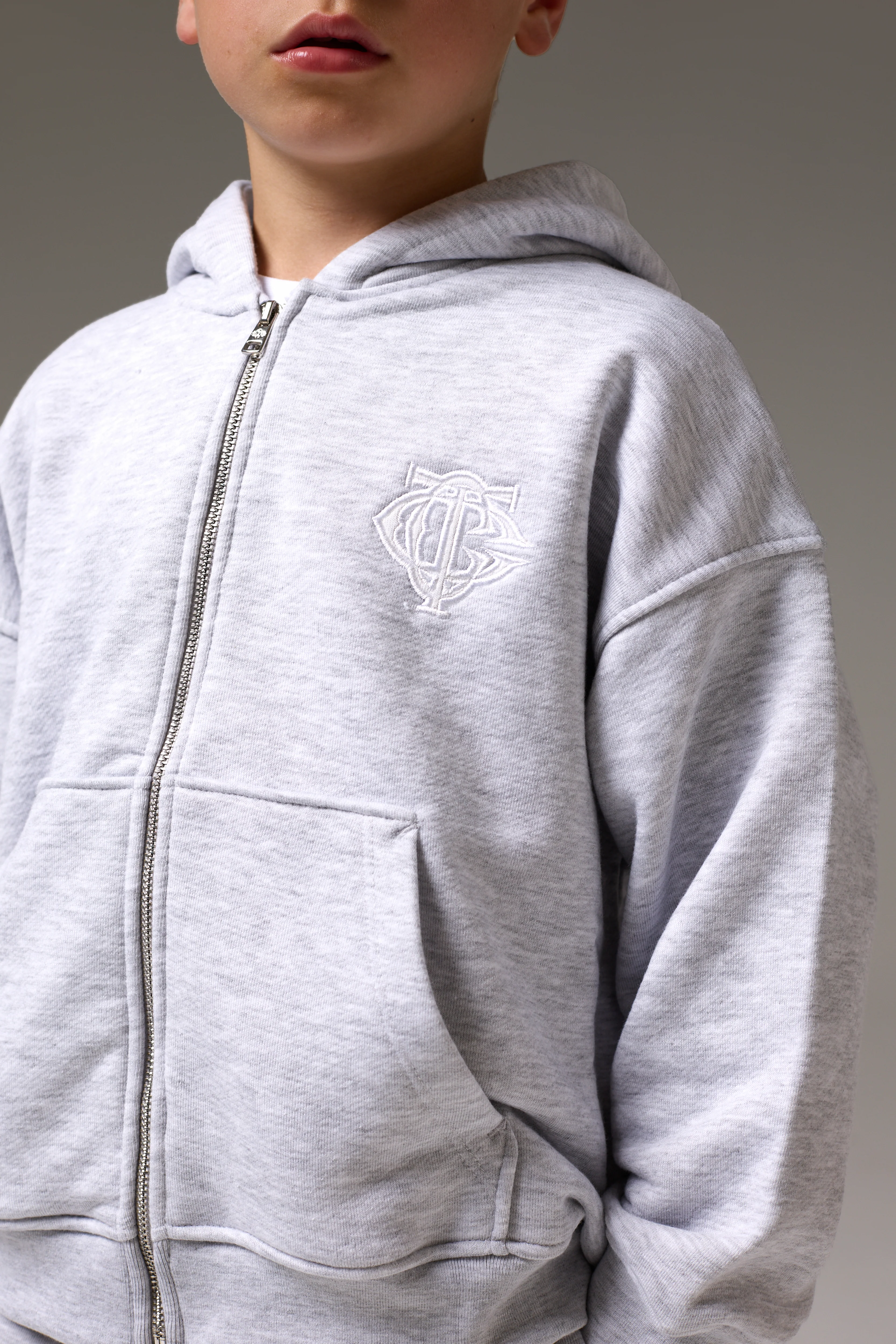 JUNIOR ZIP THROUGH MONOGRAM EMBLEM APPLIQUE HOODIE - GREY MARL