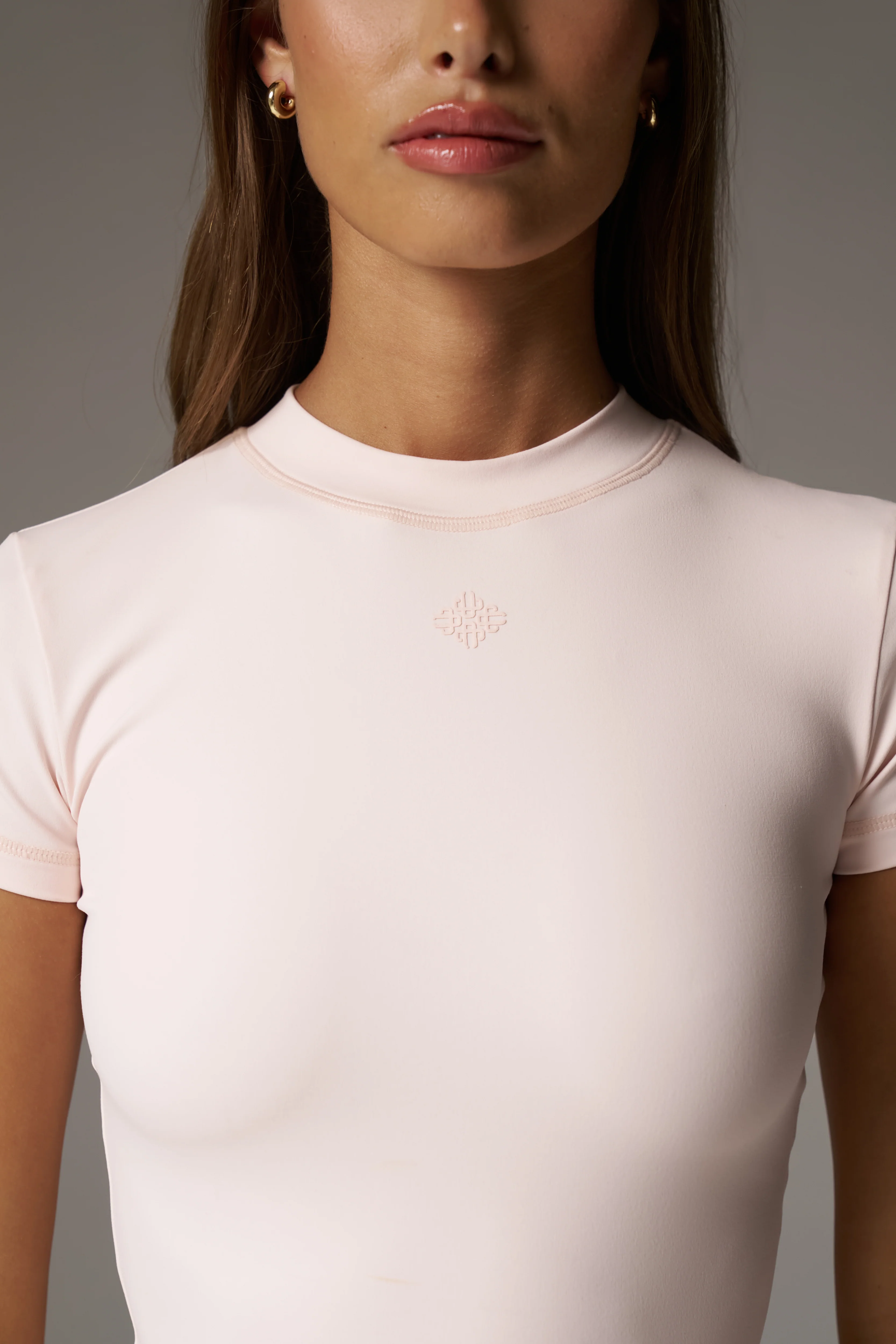 SCULPTING STRETCH EMBLEM BABY TEE - PINK