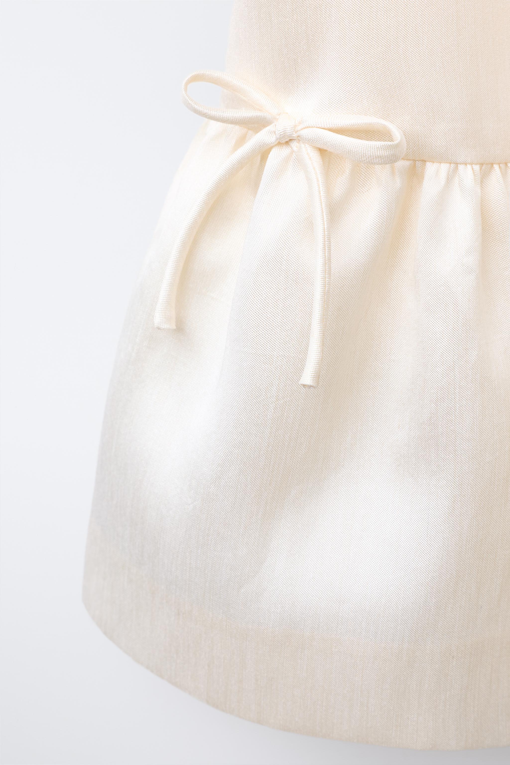 SATIN DRESS WITH BOWS