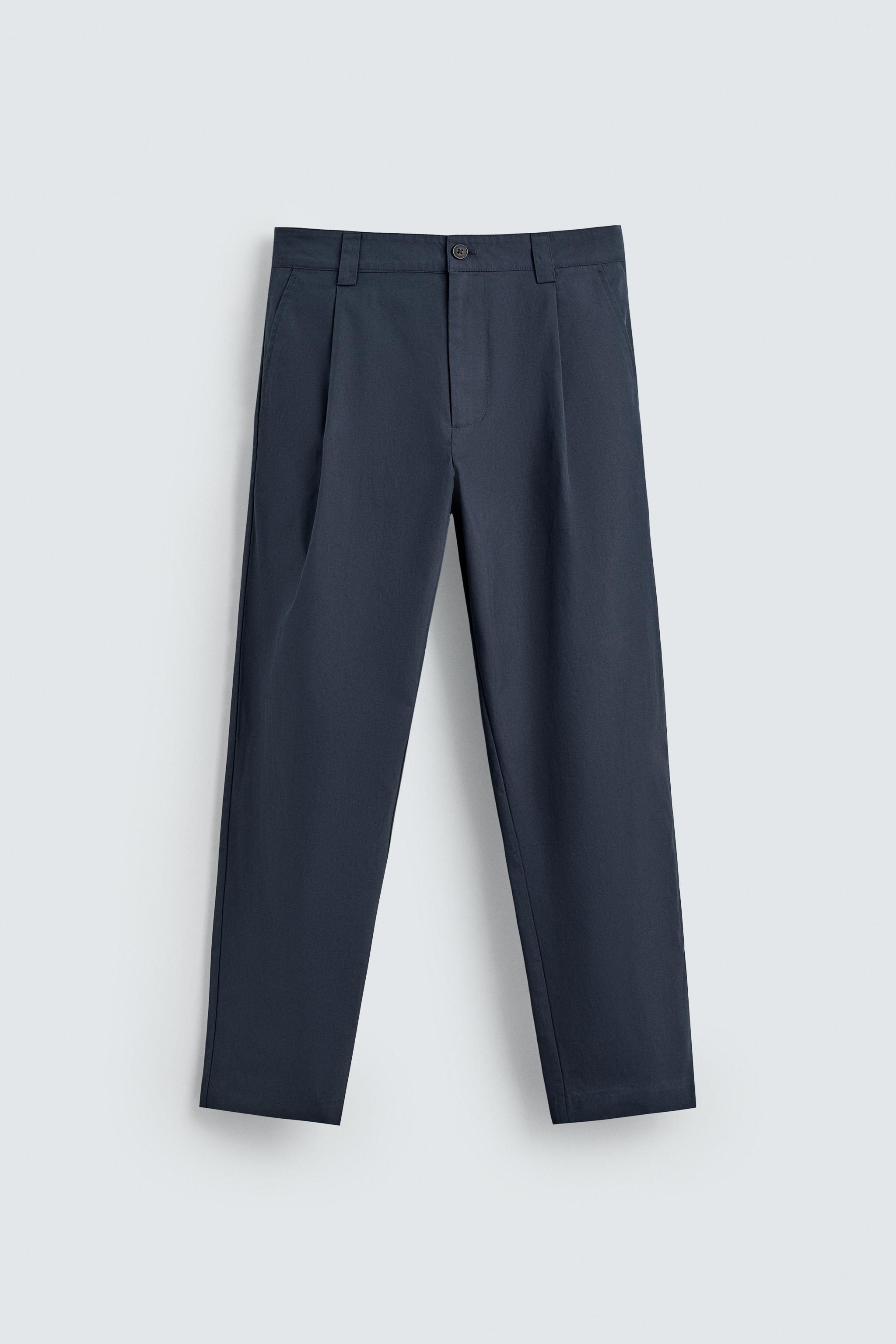 RELAXED FIT PLEATED PANTS