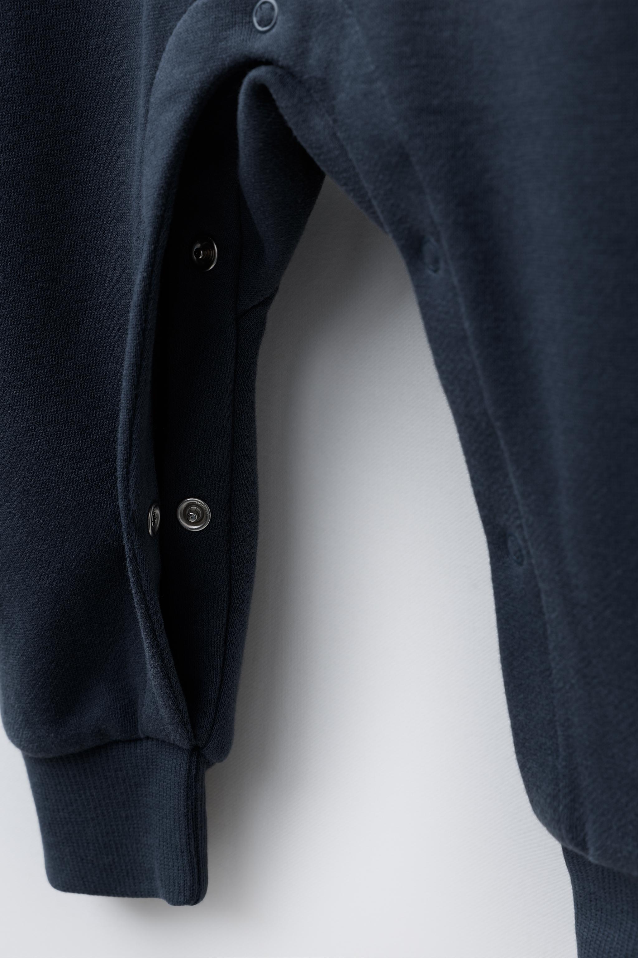 EMBROIDERED PUPPY PLUSH JUMPSUIT