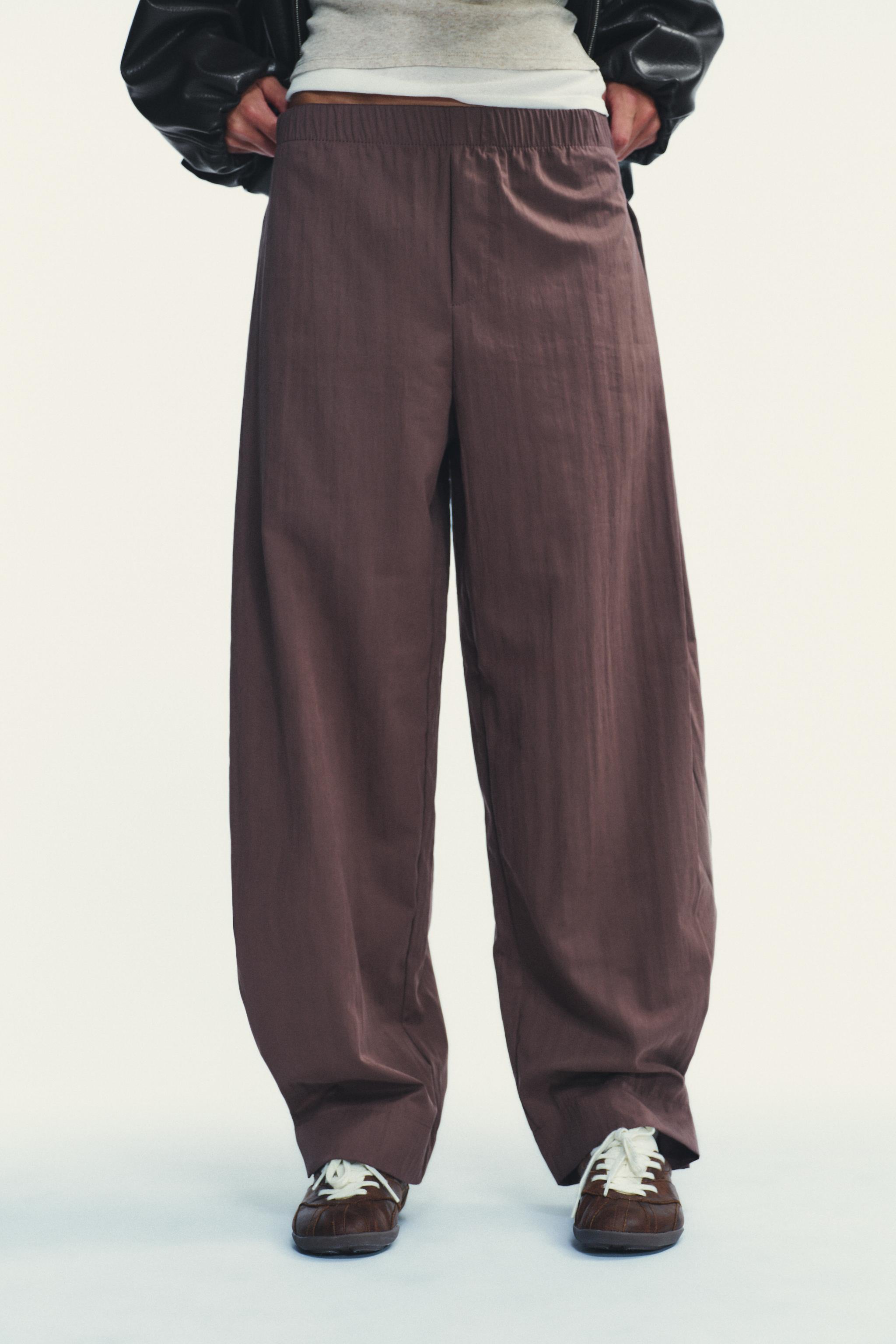 NYLON PANTS WITH BUTTON HEM